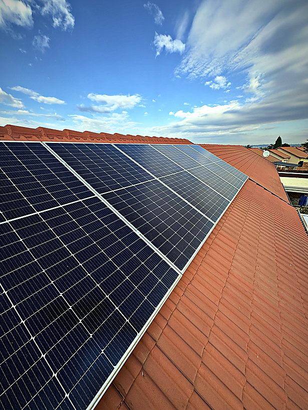 Solar array on a tiled roof in Centurion under a clear Highveld sky